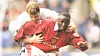 Andy Cole of Manchester United and Gerry Taggart of Bolton Wanderers