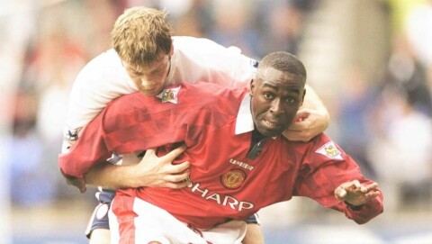 Andy Cole of Manchester United and Gerry Taggart of Bolton Wanderers