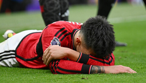 MANCHESTER, ENGLAND - FEBRUARY 04: Lisandro Martinez of manchester United lies injured during the Premier League match between Manchester United and West Ham United at Old Trafford on February 04, 2024 in Manchester, England. (Photo by Michael Regan/Getty Images)