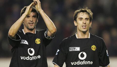 LONDON, ENGLAND - FEBRUARY 1: Roy Keane and Gary Neville of Manchester United applaud the United fans after the Barclays Premiership match between Arsenal and Manchester United at Highbury on February 1, 2005 in London, England. (Photo by John Peters/Manchester United via Getty Images)