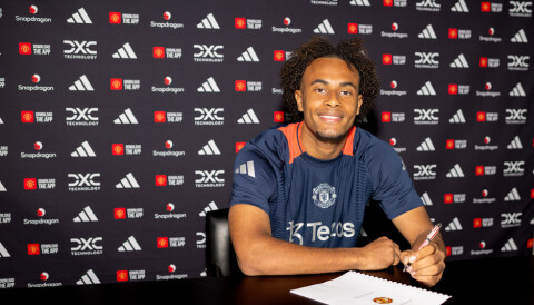 MANCHESTER, ENGLAND - JULY 14: (EXCLUSIVE COVERAGE) Joshua Zirkzee of Manchester United poses after signing for the club at Carrington Training Ground on July 14, 2024 in Manchester, England. (Photo by Manchester United/Manchester United via Getty Images)