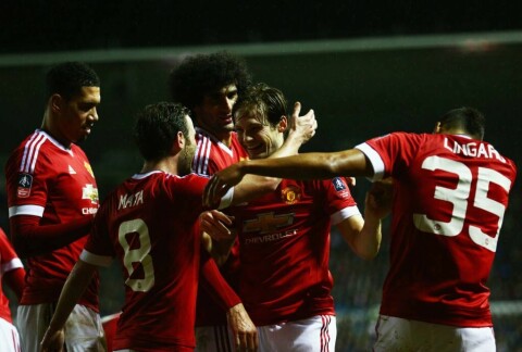 DERBY, ENGLAND - JANUARY 29: Daley Blind of Manchester United (2R) celebrates with Juan Mata and team mates as he scores their second goal during the Emirates FA Cup fourth round match between Derby County and Manchester United at iPro Stadium on January 29, 2016 in Derby, England. (Photo by Clive Mason/Getty Images)