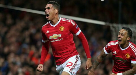 MANCHESTER, ENGLAND - SEPTEMBER 30: Chris Smalling of Manchester United celebrates scoring their second goal during the UEFA Champions League Group C match between Manchester United and VfL Wolfsburg at Old Trafford on September 30, 2015 in Manchester, United Kingdom. (Photo by Matthew Peters/Man Utd via Getty Images)