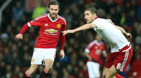 MANCHESTER, ENGLAND - JANUARY 09: Juan Mata of Manchester United in action with Chris Basham of Sheffield United during the Emirates FA Cup Third round match between Manchester United and Sheffield United at Old Trafford on January 9, 2016 in Manchester, England. (Photo by Matthew Peters/Man Utd via Getty Images)