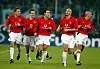Manchester United players Phil Neville, Danny Pugh, goalscorer Ruud van Nistelrooy, Rio Ferdinand, and Juan Sebastian Veron celebrate the third goal