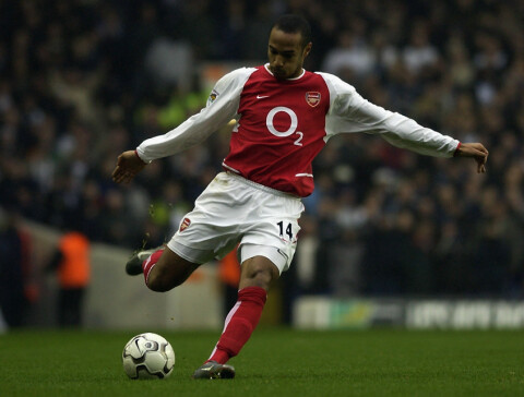 Thierry Henry of Arsenal prepares to strike the ball