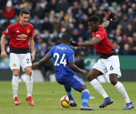 LEICESTER, ENGLAND - FEBRUARY 03: Paul Pogba of Manchester United in action with Nampalys Mendy of Leicester City during of the Premier League match between Leicester City and Manchester United at The King Power Stadium on February 03, 2019 in Leicester, United Kingdom. (Photo by Tom Purslow/Man Utd via Getty Images)