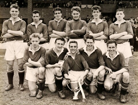 The Manchester United Youth football team with their trophy after defeating West Bromwich Albion by a score of 3-0 in the FA Youth Challenge Cup Final at The Hawthorns, West Bromwich on 30th April 1955. The team are, back row (left-right): Duncan Edwards, Terry Beckett, Shay Brennan, Tony Hawksworth, Alan Rhodes, John Queenan. Front row: Peter Jones, Dennis Fidler, Eddie Colman, Wilf McGuinness and Bobby Charlton. (Photo by Popperfoto/Getty Images)
