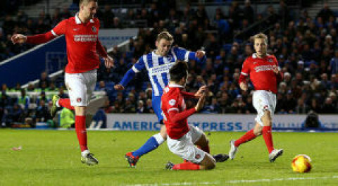 BRIGHTON, ENGLAND - DECEMBER 05: James Wilson of Brighton scores the teams first goal during the Sky Bet Championship match between Brighton and Hove Albion and Charlton Athletic at The Amex Stadium on December 05, 2015 in Brighton, England. (Photo by Charlie Crowhurst/Getty Images)