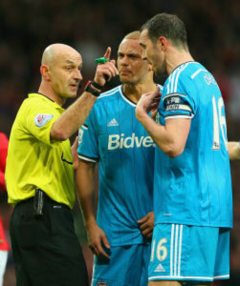 MANCHESTER, ENGLAND - FEBRUARY 28: Wes Brown of Sunderland reacts after being shown a straight red card by Refere Roger East as John O'Shea of Sunderland appeals during the Barclays Premier League match between Manchester United and Sunderland at Old Trafford on February 28, 2015 in Manchester, England. (Photo by Alex Livesey/Getty Images)