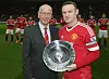 MANCHESTER, ENGLAND - DECEMBER 19: Wayne Rooney of Manchester United is presented with an award by Sir Bobby Charlton to mark his 500th appearance for the club ahead of the Barclays Premier League match between Manchester United and Norwich City at Old Trafford on December 19, 2015 in Manchester, England. (Photo by John Peters/Man Utd via Getty Images)