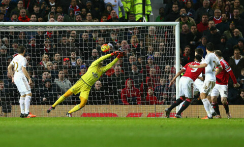 MANCHESTER, ENGLAND - JANUARY 02: Anthony Martial (3rd L) of Manchester United heads the ball to score his team's first goal past Lukasz Fabianski (2nd L) of Swansea City during the Barclays Premier League match between Manchester United and Swansea City at Old Trafford on January 2, 2016 in Manchester, England. (Photo by Clive Brunskill/Getty Images)