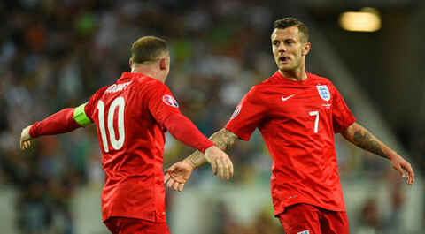 LJUBLJANA, SLOVENIA - JUNE 14: Jack Wilshere of England (R) celebrates scoring their first goal with Wayne Rooney of England during the UEFA EURO 2016 Qualifier between Slovenia and England on at the Stozice Arena on June 14, 2015 in Ljubljana, Slovenia. (Photo by Stu Forster/Getty Images)