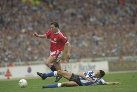 Bryan Robson of Manchester United and Paul Williams of Sheffield Wednesday