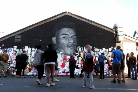 Defaced Mural Of Marcus Rashford Repaired By The Artist In Manchester