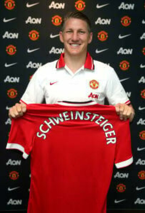 MANCHESTER, ENGLAND - JULY 13: (EXCLUSIVE COVERAGE) (MINIMUM FEES APPLY - 150 GBP PRINT AND ON AIR & 75 GBP ONLINE OR LOCAL EQUIVALENT, PER IMAGE) Bastian Schweinsteiger of Manchester United poses after signing for the club at Aon Training Complex on July 13, 2015 in Manchester, England. (Photo by John Peters/Man Utd via Getty Images)