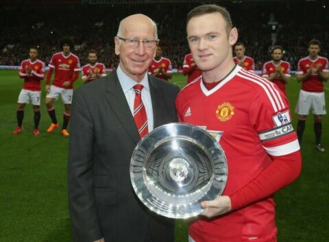 MANCHESTER, ENGLAND - DECEMBER 19: Wayne Rooney of Manchester United is presented with an award by Sir Bobby Charlton to mark his 500th appearance for the club ahead of the Barclays Premier League match between Manchester United and Norwich City at Old Trafford on December 19, 2015 in Manchester, England. (Photo by John Peters/Man Utd via Getty Images)