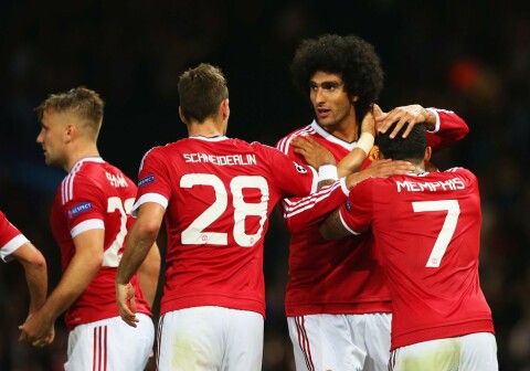 MANCHESTER, ENGLAND - AUGUST 18: Marouane Fellaini of Manchester United celebrates scoring his team's third goal with Morgan Schneiderlin and Memphis Depay during the UEFA Champions League Qualifying Round Play Off First Leg match between Manchester United and Club Brugge at Old Trafford on August 18, 2015 in Manchester, England. (Photo by Alex Livesey/Getty Images)