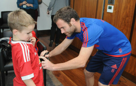 MANCHESTER, ENGLAND - SEPTEMBER 21: Juan Mata of Manchester United poses with Jordan, 9, from Corby, at the MU Foundation Dream Day, where poorly children meet the Manchester United team, at Aon Training Complex on September 21, 2015 in Manchester, England. (Photo by Ian Cartwright/Man Utd via Getty Images)
